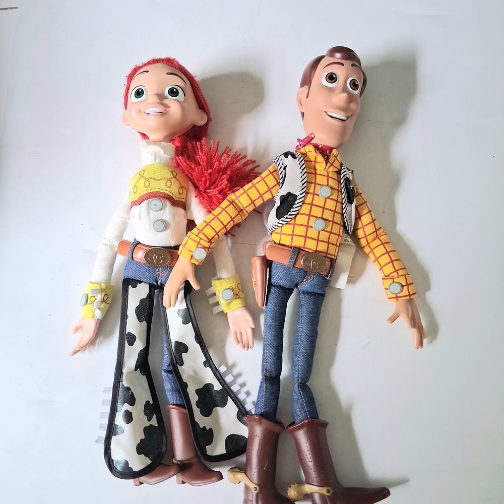 Disney pixar talking pull string woody and jessie toy 14" dolls. Both work.